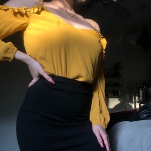 yellow flowy top paired with black pencil skirt